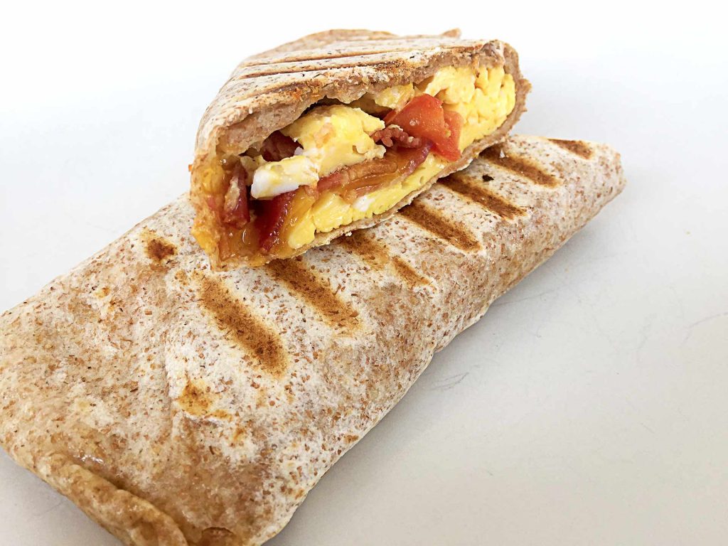 Bacon Cheddar Breakfast Wrap at West Village Cafe